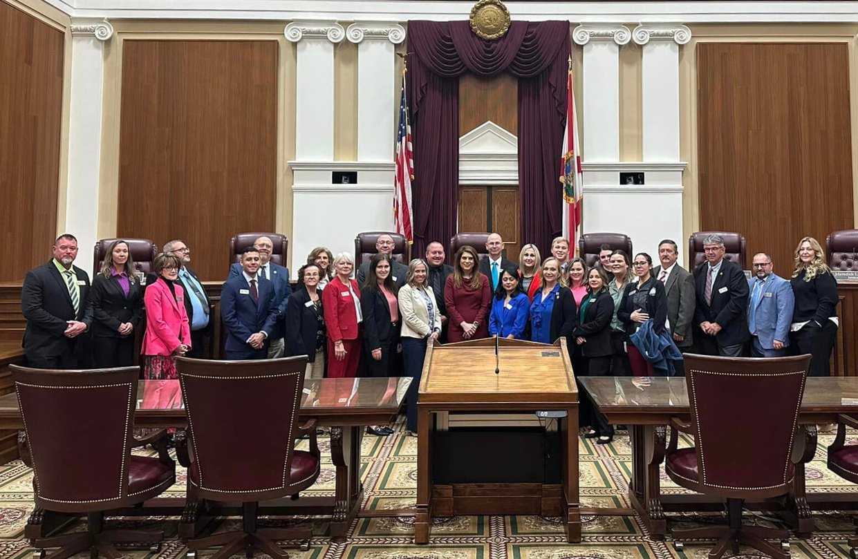 Group standing in state courthouse