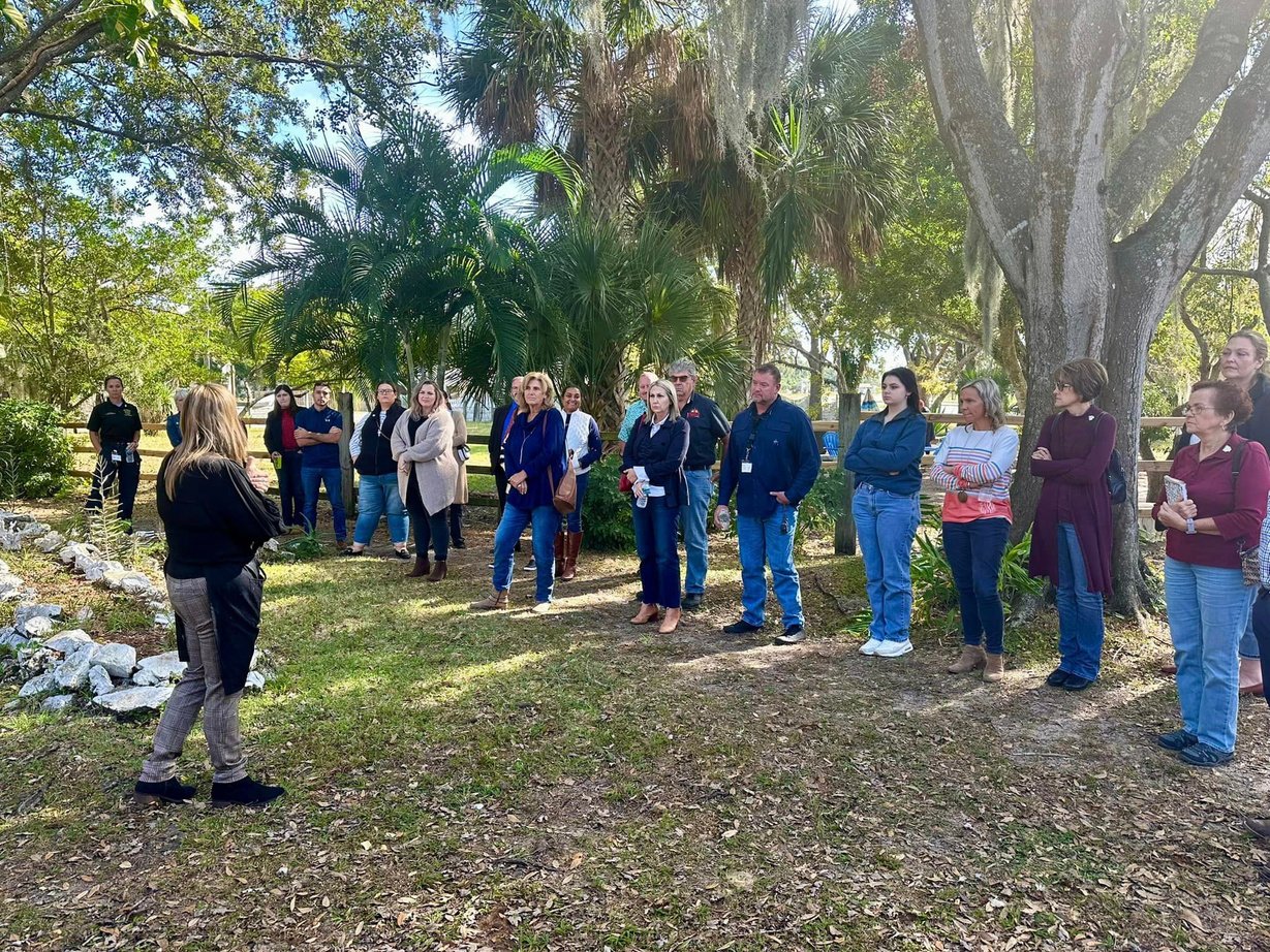 Group standing outside in a park setting